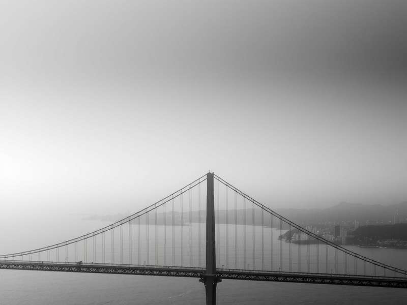 Pattullo Bridge spanning a river with scenic views