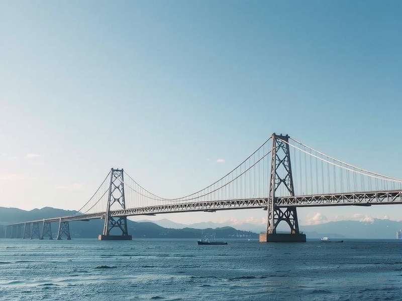 The Humber Bridge spanning a wide river estuary during sunset